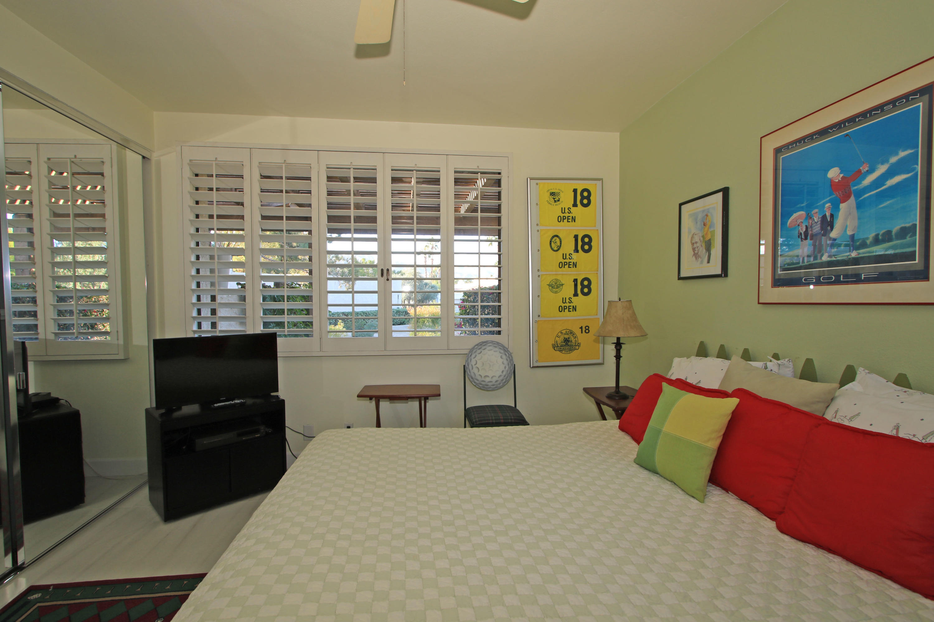 913 Inverness Drive Rancho Mirage, CA 92270 - Photo 33 of 52 a bedroom with a bed and wooden floor