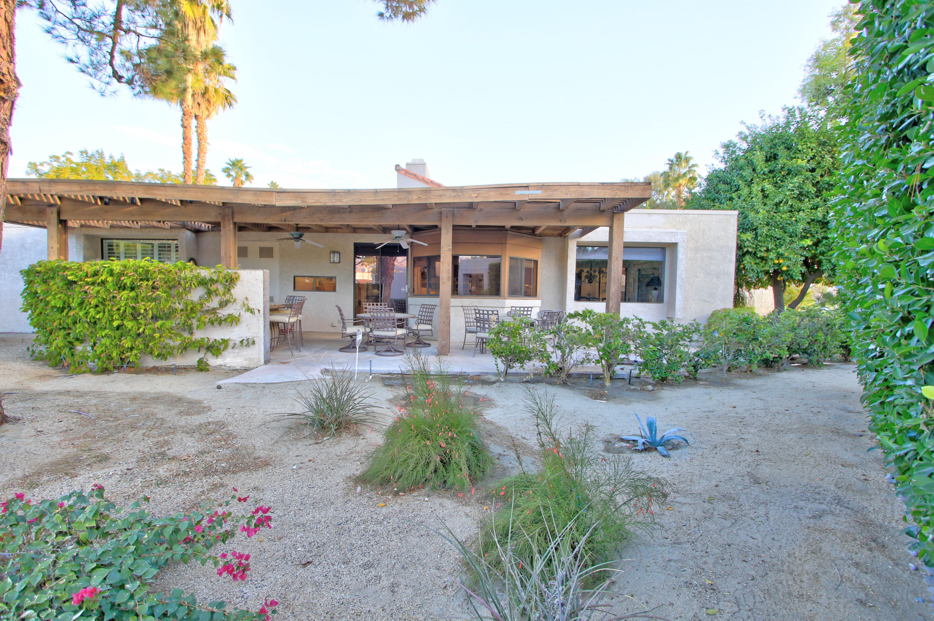 913 Inverness Drive Rancho Mirage, CA 92270 - Photo 36 of 52 a front view of a house with garden