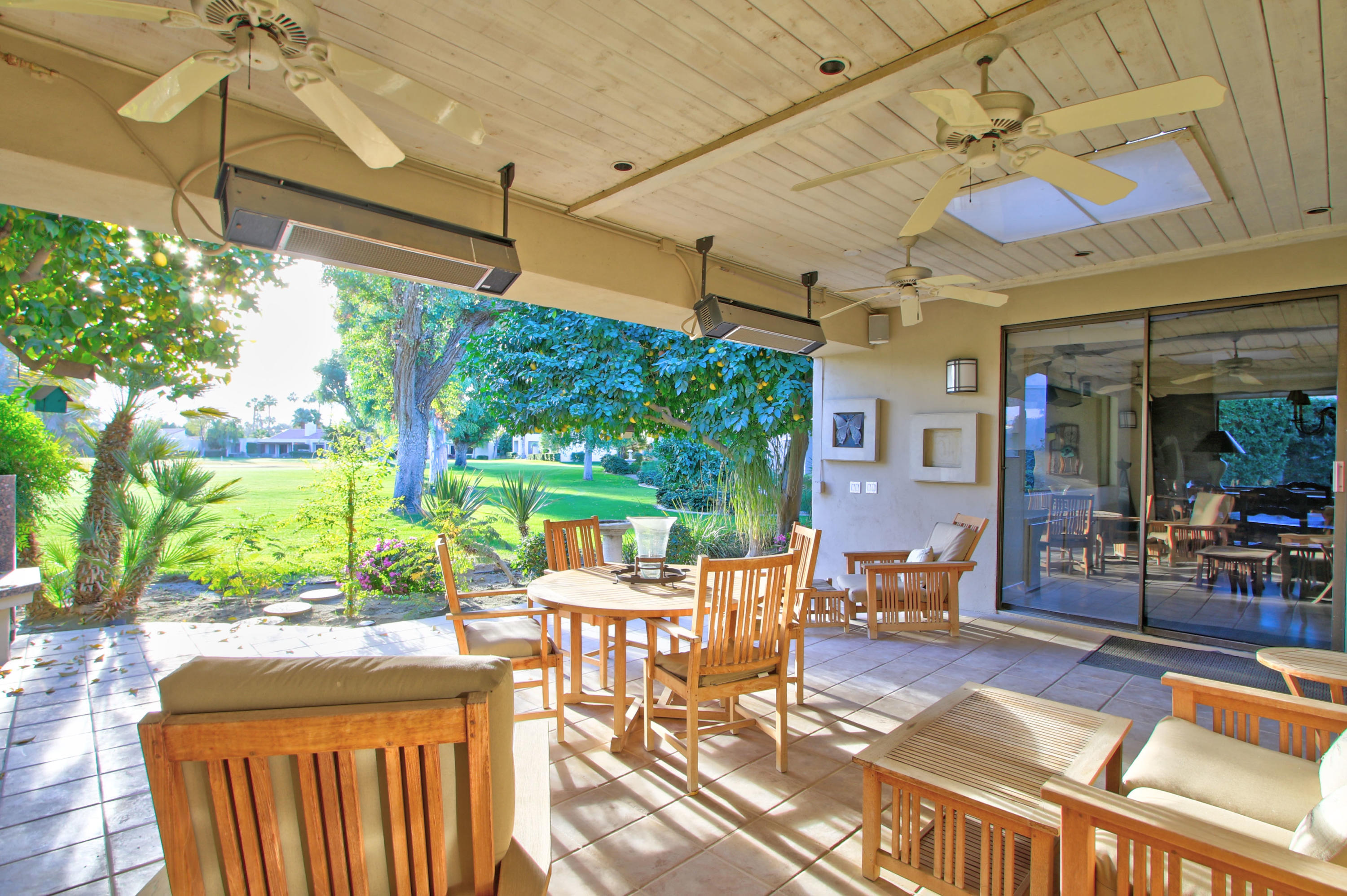913 Inverness Drive Rancho Mirage, CA 92270 - Photo 40 of 52 a view of a chairs and table in a patio