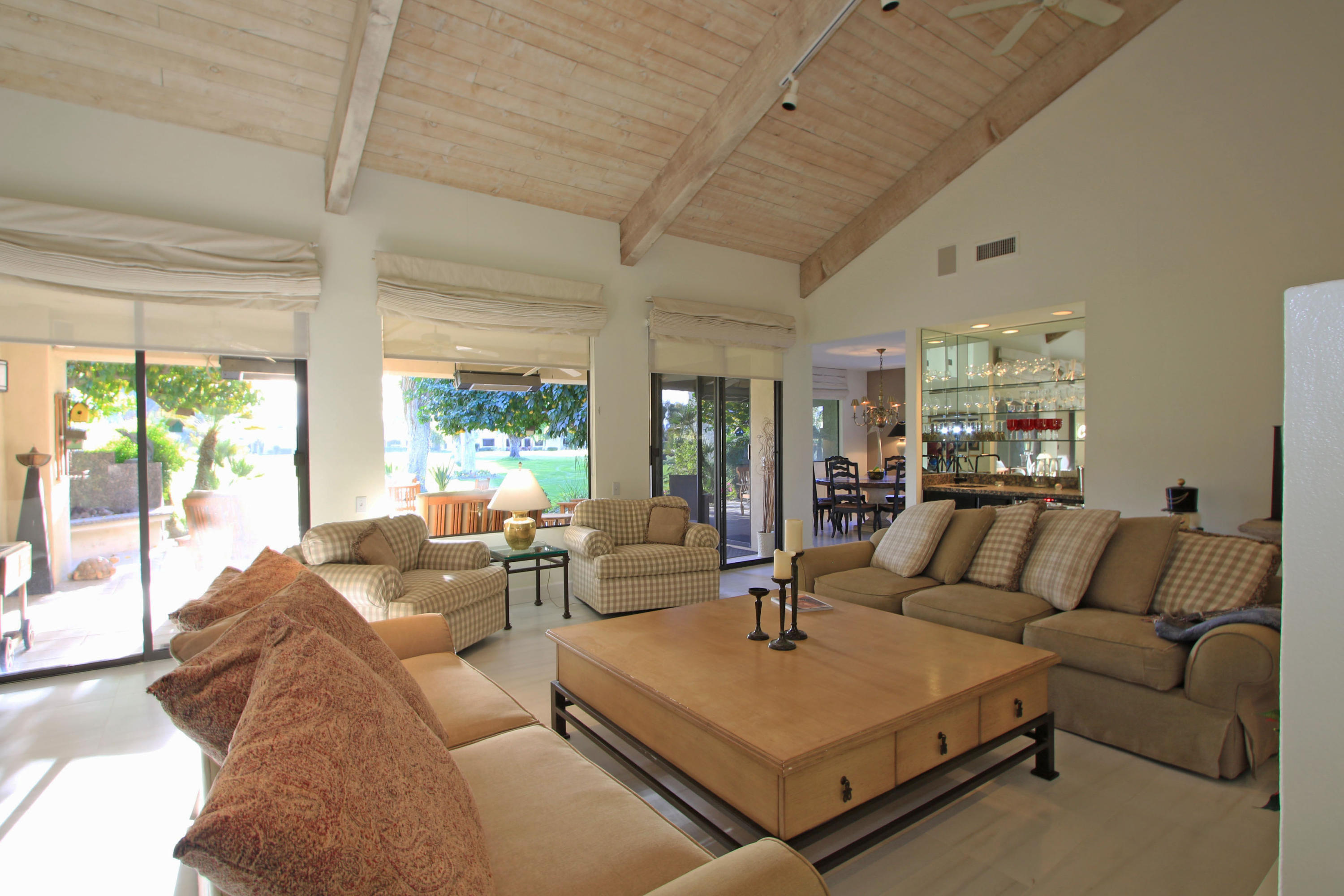 913 Inverness Drive Rancho Mirage, CA 92270 - Photo 9 of 52 a living room with furniture and a large window