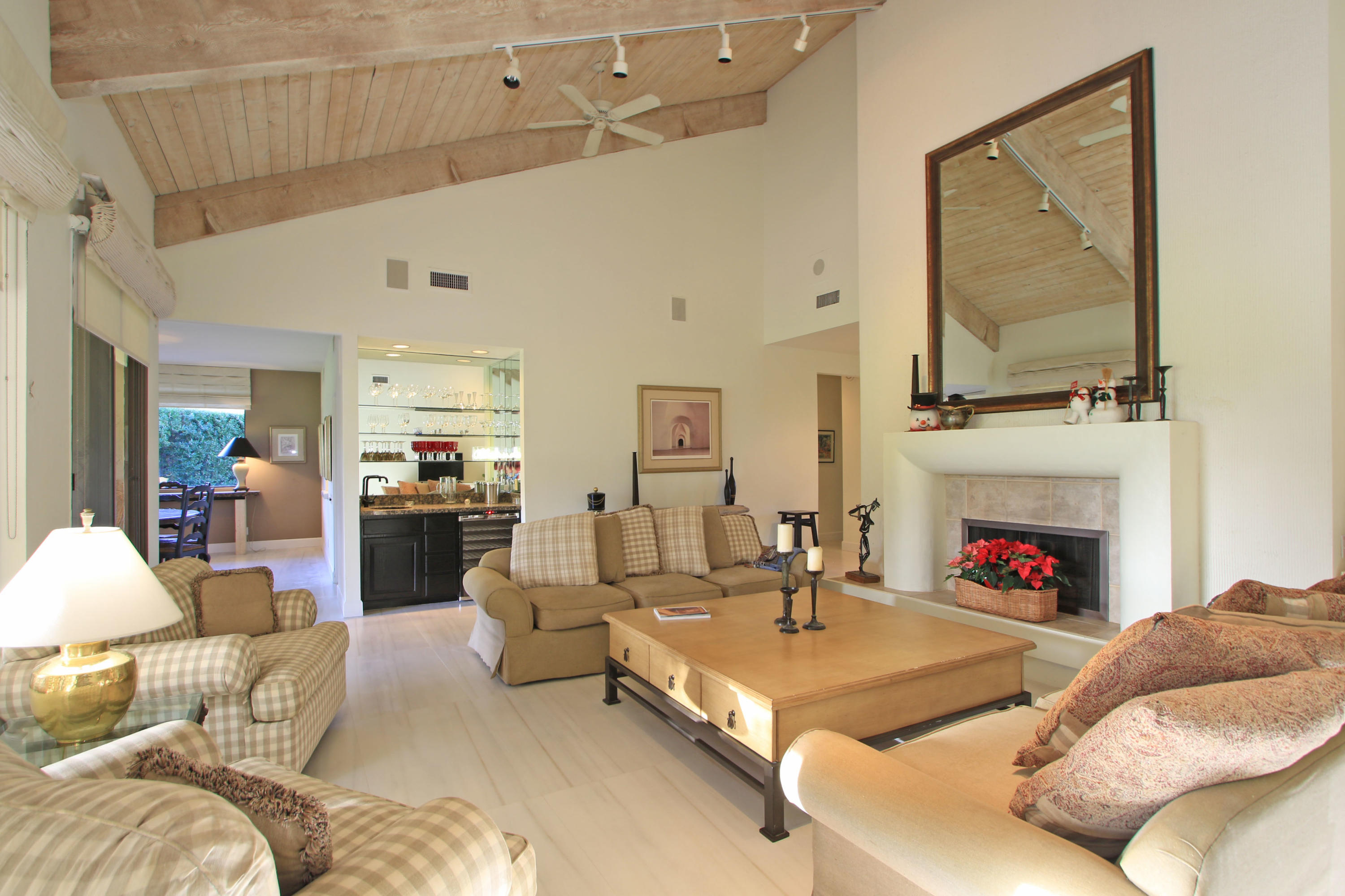 913 Inverness Drive Rancho Mirage, CA 92270 - Photo 10 of 52 a living room with furniture fireplace and flat screen tv