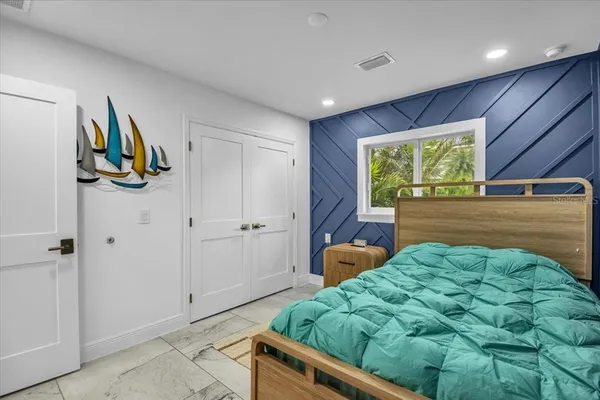 a bed room with a bed and a dresser