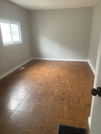 a view of an empty room and window