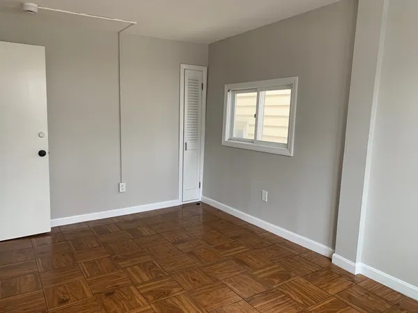 a view of an empty room with a window