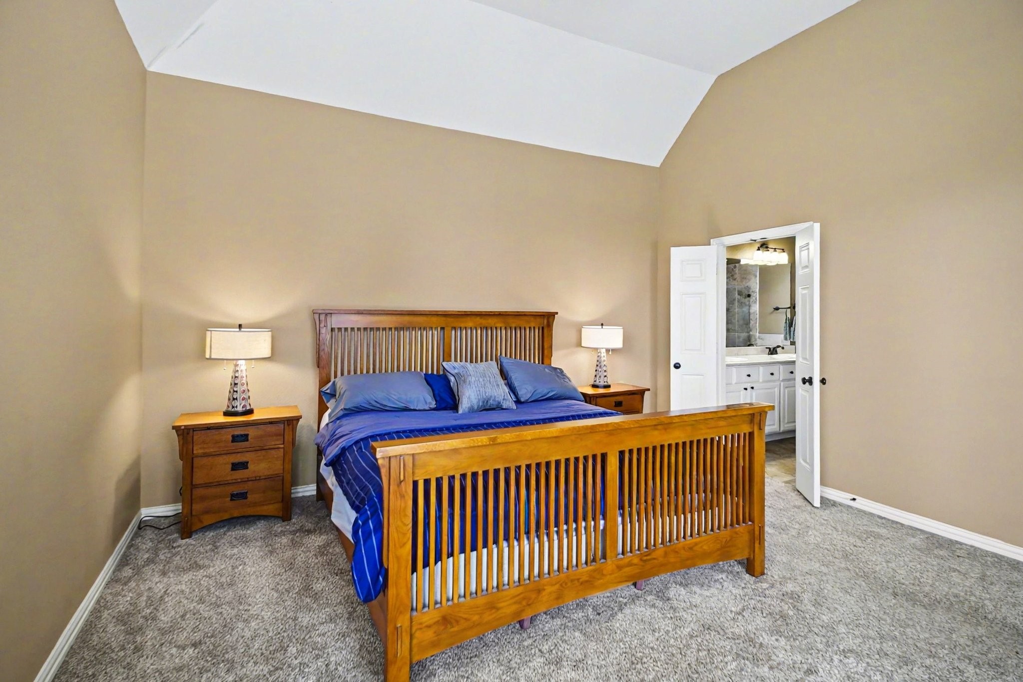 8210 Thunder Ridge Way Missouri City, TX 77459 - Photo 23 of 42 Discover the spacious primary suite with a glimpse of the elegant ensuite bathroom.