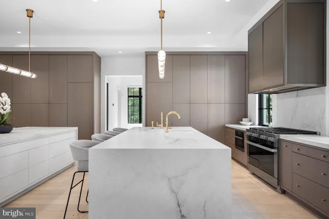 a kitchen with a sink a toilet and a mirror