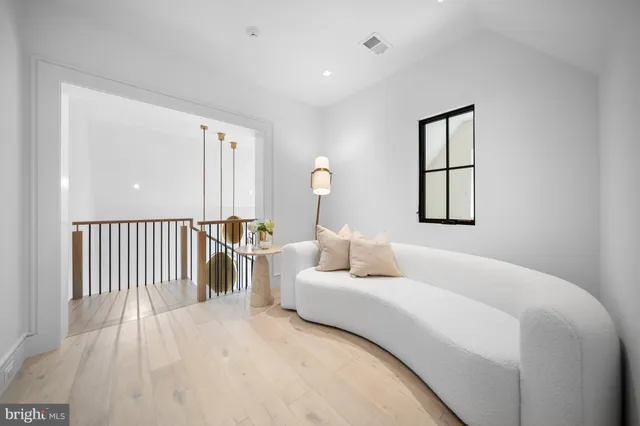 a spacious bathroom with a tub double sink and mirror