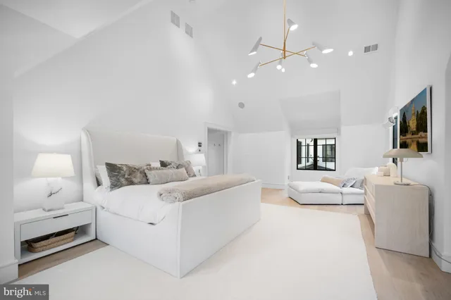 a view of a hallway with a chandelier