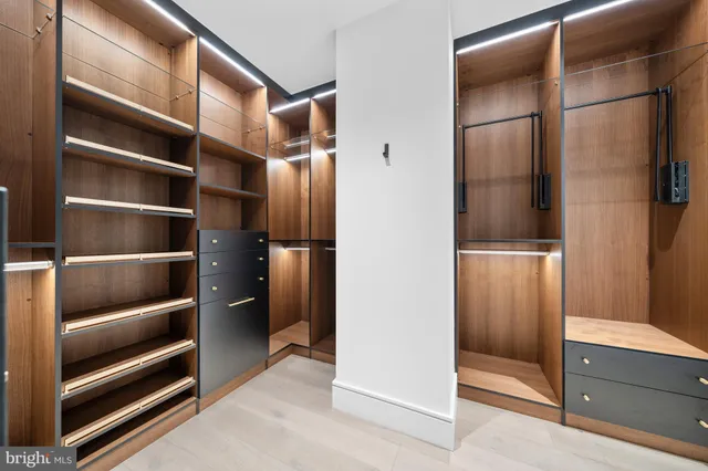 a bathroom with a granite countertop sink a toilet and a mirror