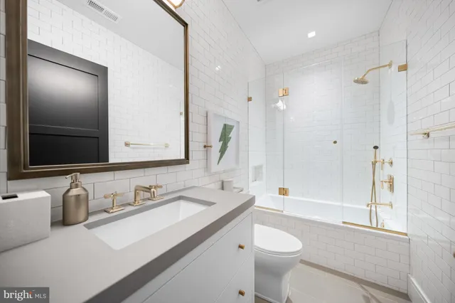a kitchen with counter top space cabinets and appliances