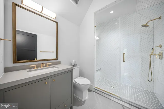 a bathroom with a tub and shower