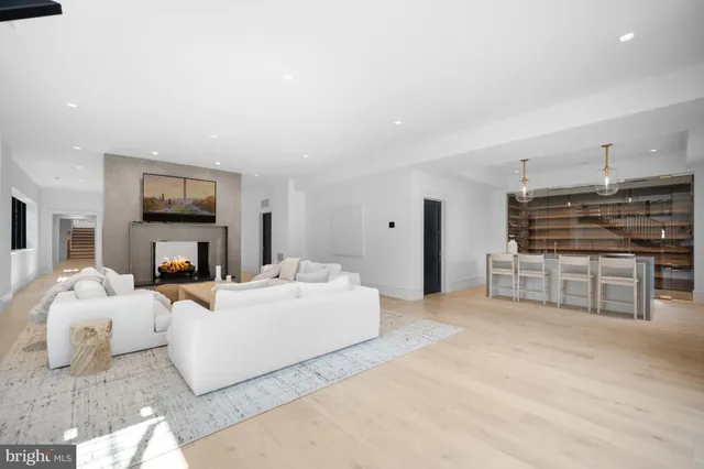 a bathroom with a toilet a sink and a mirror