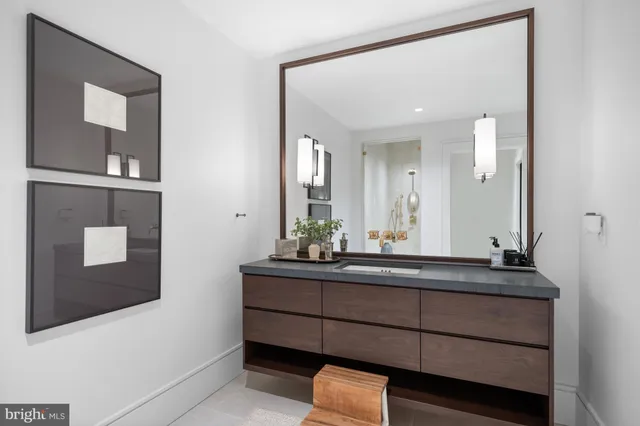 a sign that is sitting in front of a house