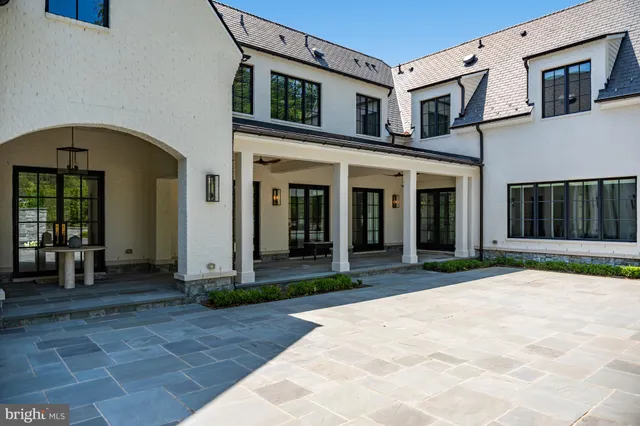 a house view with a sitting space and garden