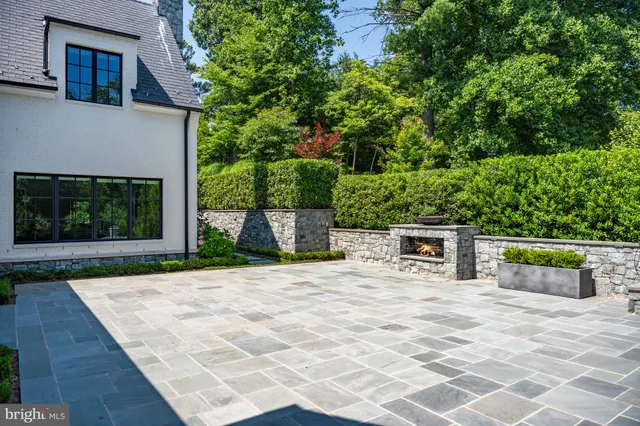 a view of a garden with a building in the background