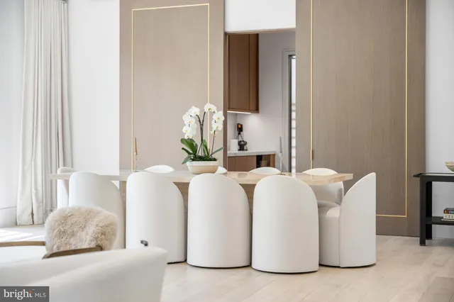 a living room with furniture lamp and window