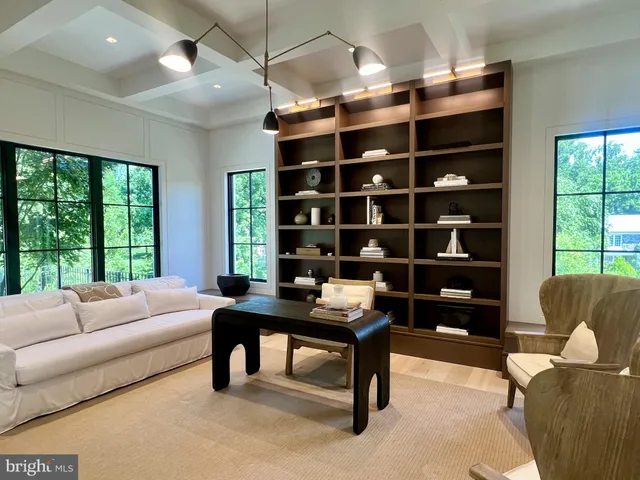 a kitchen with a sink dishwasher a stove and cabinets with wooden floor