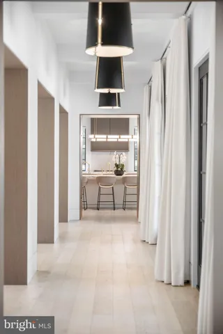 a large kitchen with a table and chairs