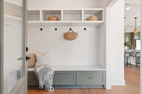 a bathroom with a granite countertop sink toilet and mirror