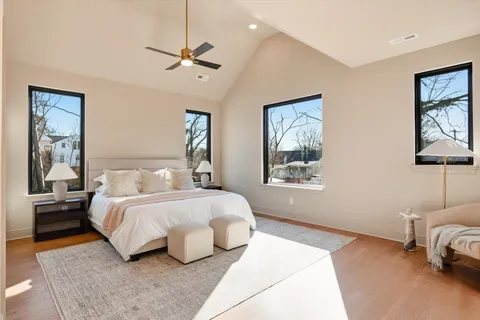 a bathroom with a double vanity sink mirror and shower