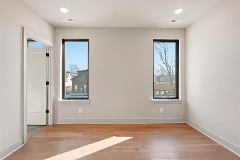 a view of a patio with couches table and chairs and potted plants