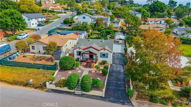 an aerial view of residential houses with yard