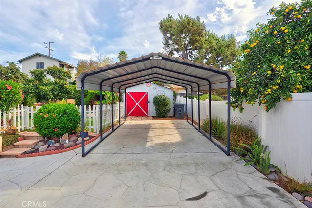 a view of a golf course with a table and chairs