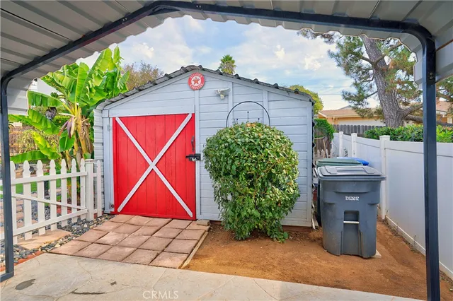 a view of a backyard with sitting area