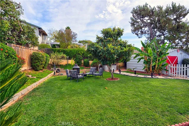 an aerial view of a house with a garden and plants