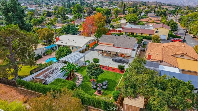 an aerial view of multiple houses with yard