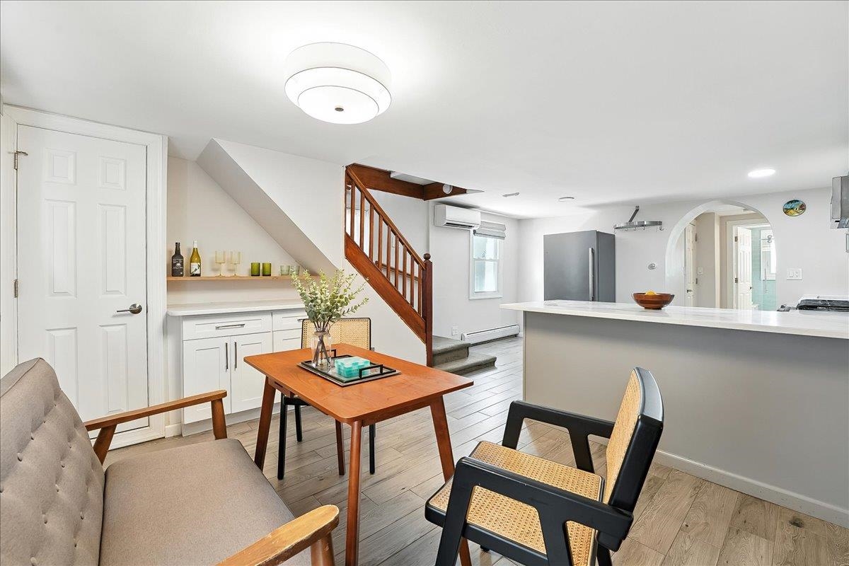 221 Terrace Avenue Jersey City, NJ 07307 - Photo 12 of 37 a view of a dining room with furniture and wooden floor