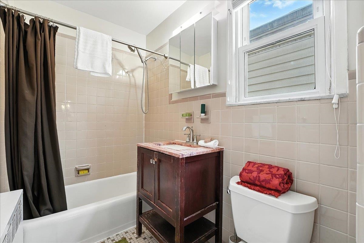 221 Terrace Avenue Jersey City, NJ 07307 - Photo 22 of 37 a bathroom with a sink toilet and shower