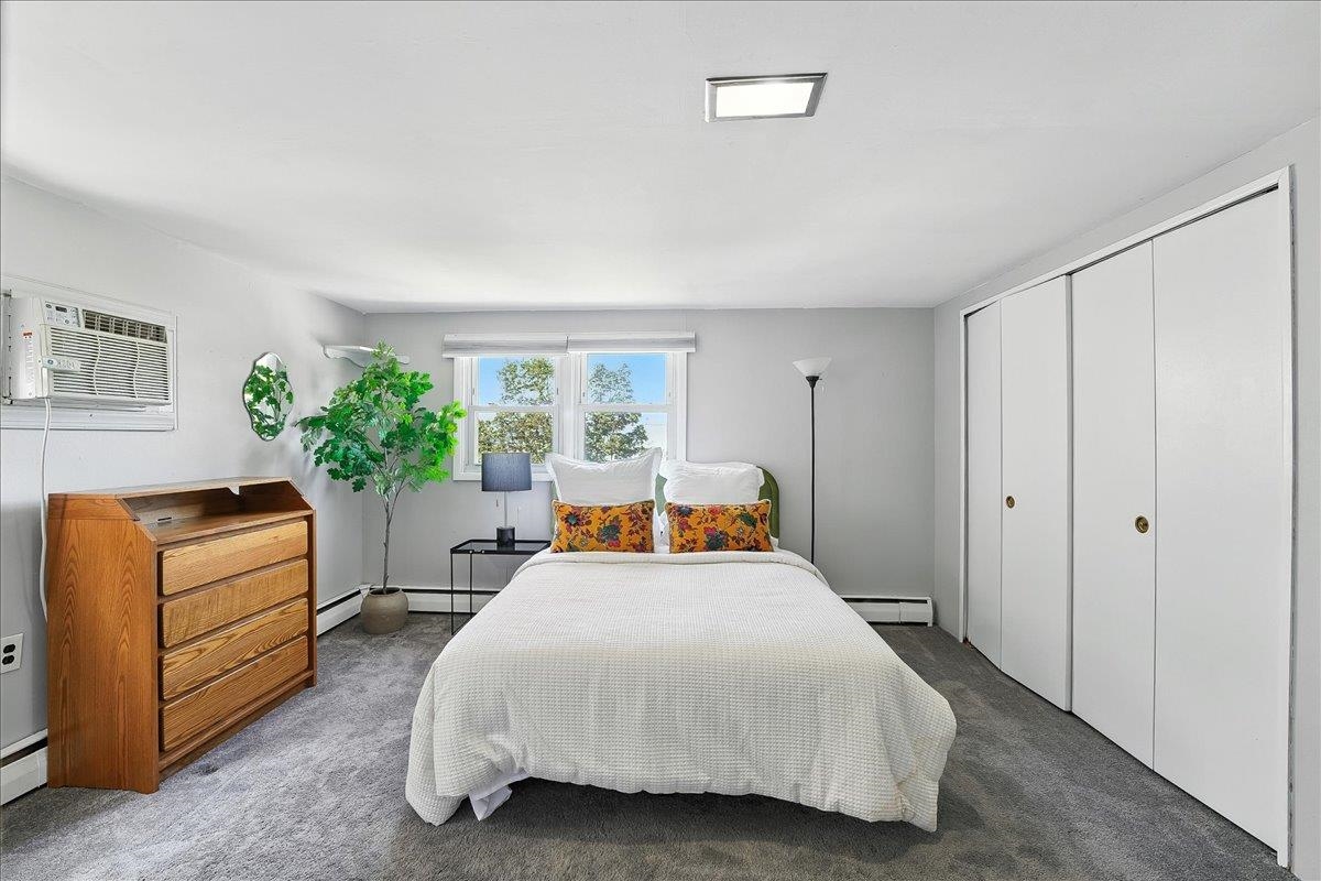 221 Terrace Avenue Jersey City, NJ 07307 - Photo 26 of 37 a bed room with a bed and a couch