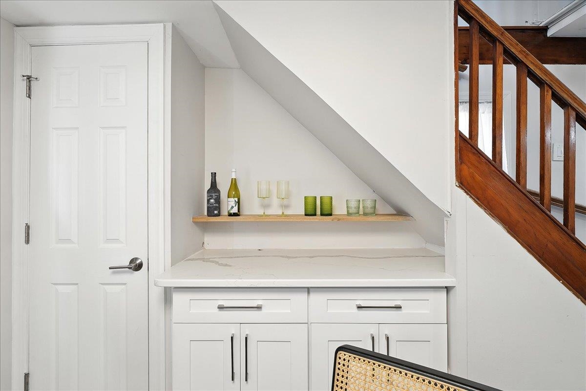 221 Terrace Avenue Jersey City, NJ 07307 - Photo 9 of 37 a view of staircase with white cabinets and floors