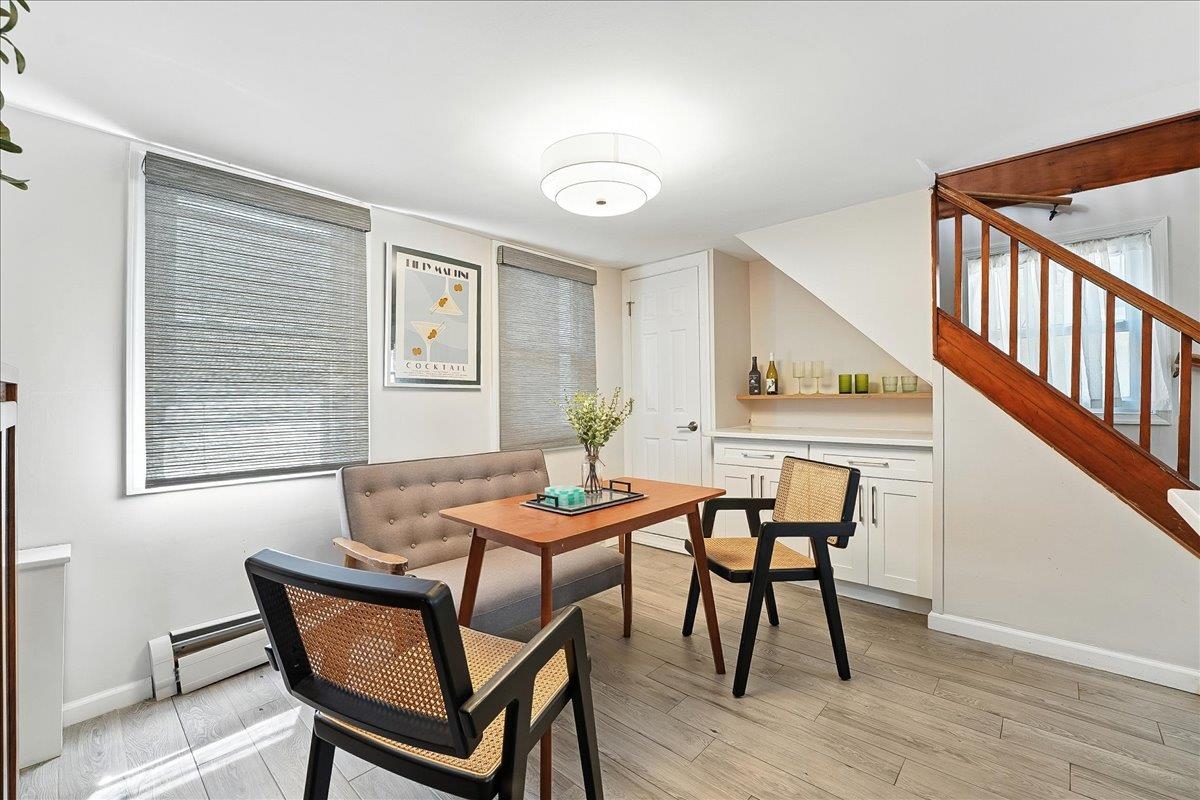 221 Terrace Avenue Jersey City, NJ 07307 - Photo 10 of 37 a dining room with furniture and wooden floor