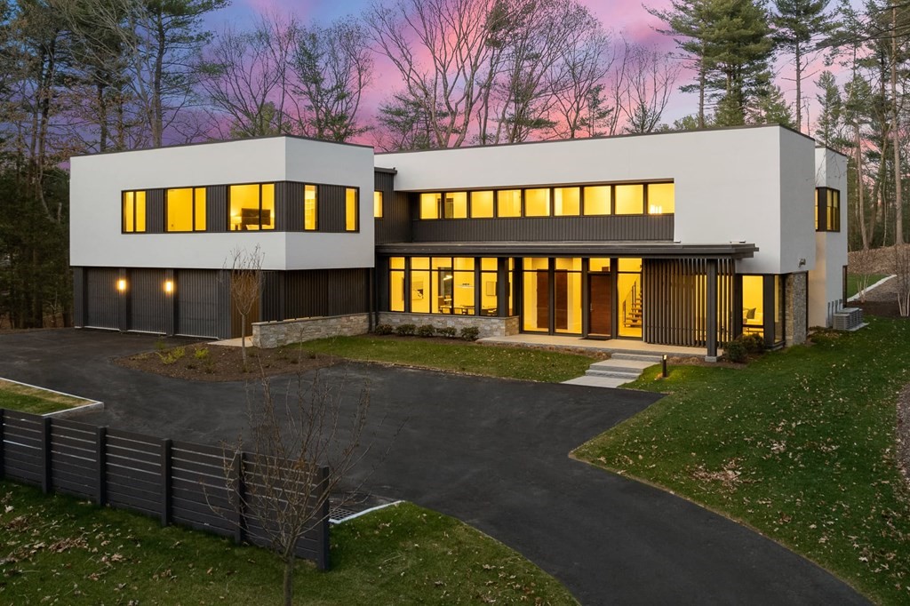 a view of wooden house and a yard