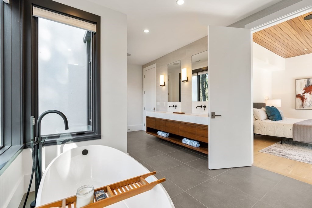 101 Black Oak Road Weston, MA 02493 - Photo 23 of 42 a spacious bathroom with a tub and mirror