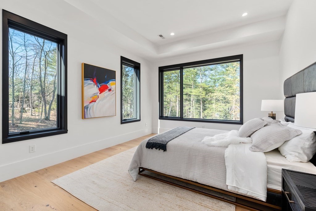 101 Black Oak Road Weston, MA 02493 - Photo 24 of 42 a bedroom with a bed and a large window