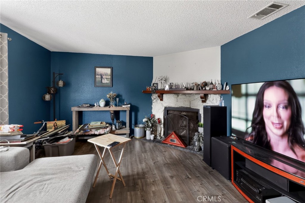 21985 Maumee Road Apple Valley, CA 92308 - Photo 12 of 30 a living room with furniture and a fireplace