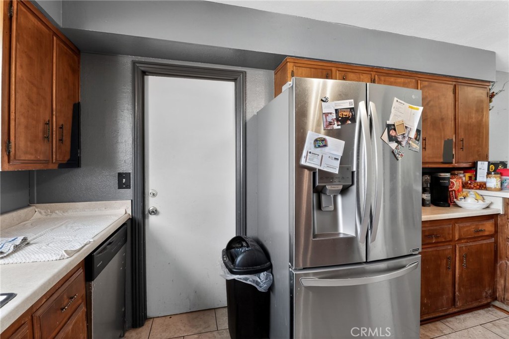 21985 Maumee Road Apple Valley, CA 92308 - Photo 15 of 30 a kitchen with stainless steel appliances granite countertop a refrigerator and a sink