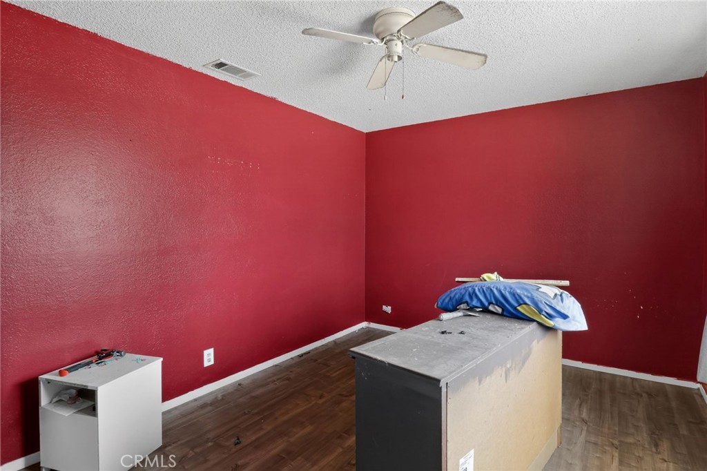 21985 Maumee Road Apple Valley, CA 92308 - Photo 25 of 30 a kitchen with a sink cabinets and wooden floor