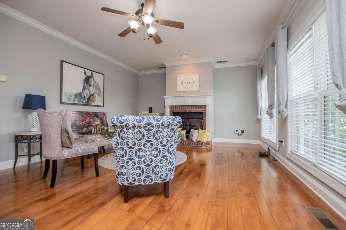 1074 Glenloch Road Roopville, GA 30170 - Photo 13 of 98 a living room with furniture and a fireplace