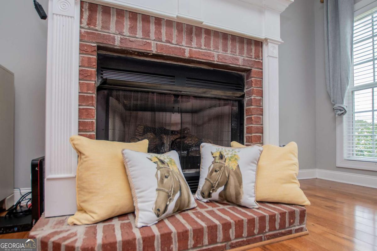 1074 Glenloch Road Roopville, GA 30170 - Photo 15 of 98 a living room with furniture and a fireplace