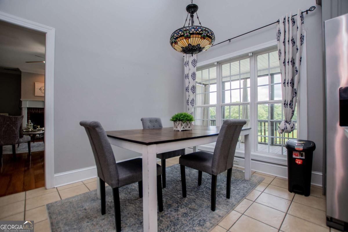 1074 Glenloch Road Roopville, GA 30170 - Photo 19 of 98 a view of a dining room with furniture window and wooden floor