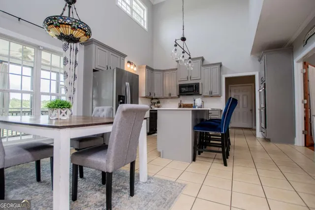 a bathroom with a sink a toilet and shower curtain