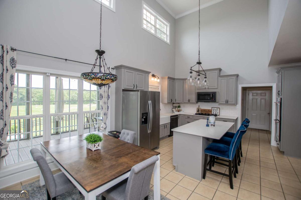 1074 Glenloch Road Roopville, GA 30170 - Photo 21 of 98 a view of a dining room with furniture window and outside view