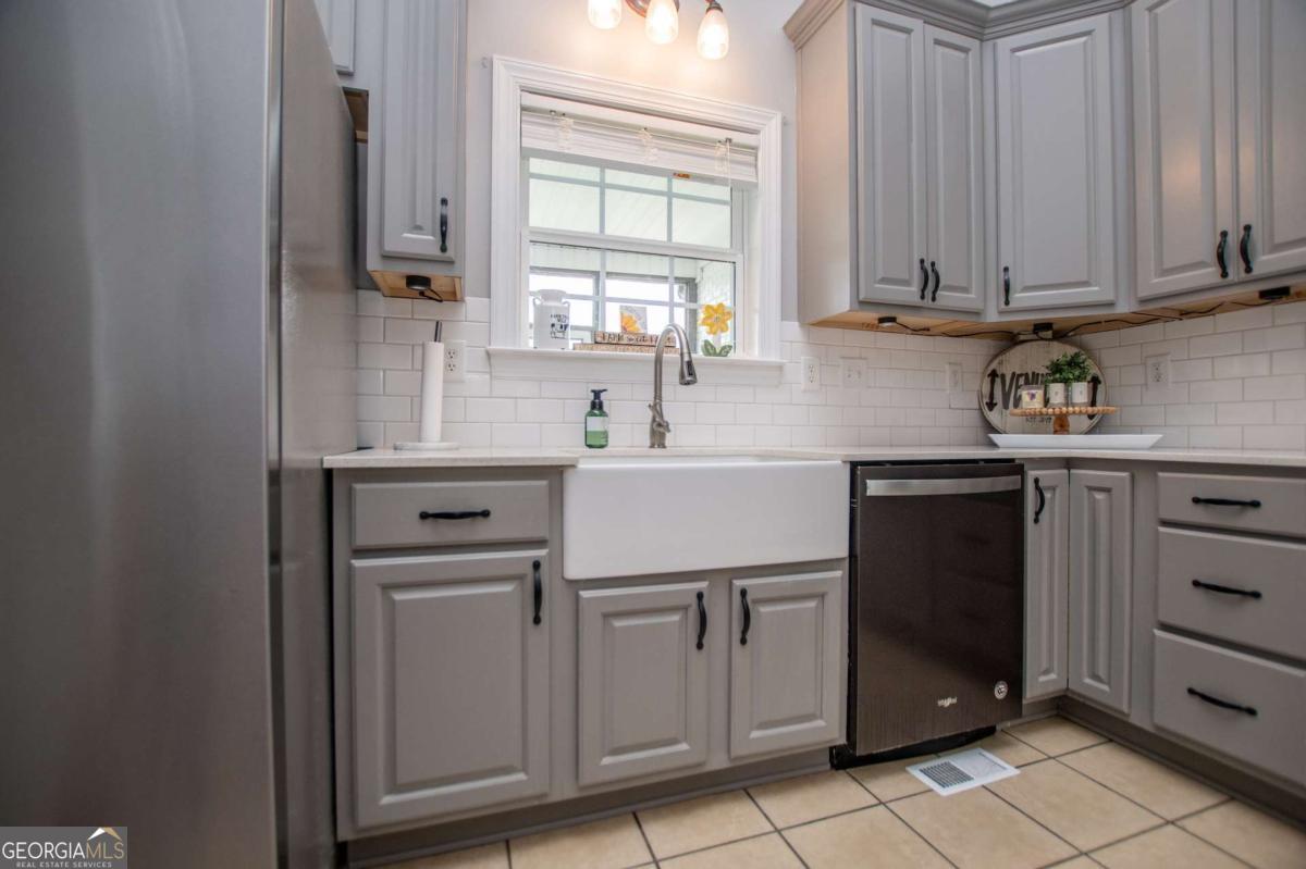 1074 Glenloch Road Roopville, GA 30170 - Photo 22 of 98 a kitchen with a sink cabinets and window
