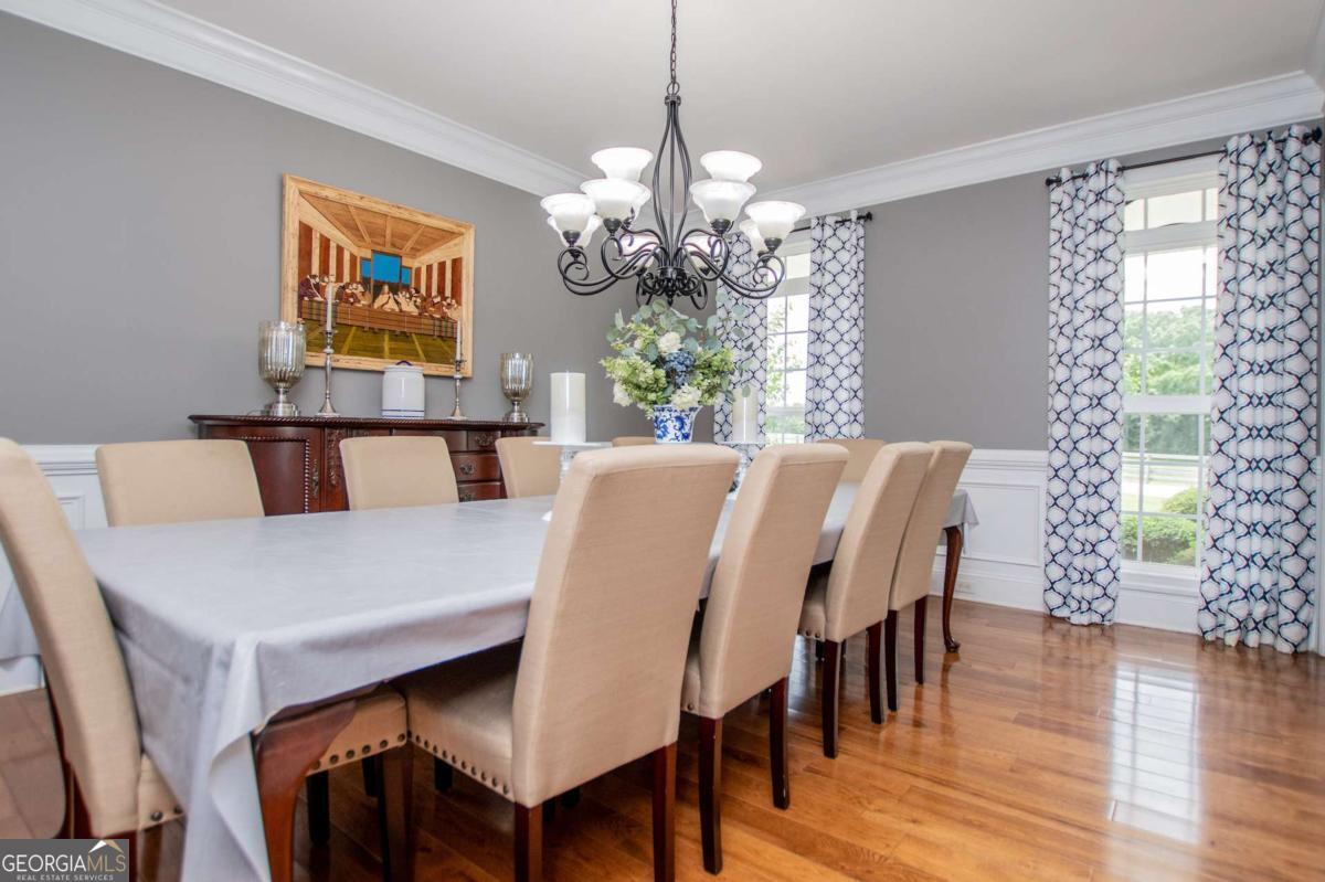 1074 Glenloch Road Roopville, GA 30170 - Photo 24 of 98 a view of a dining room with furniture window and wooden floor