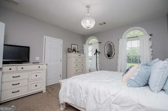 a aerial view of an house with swimming pool and green space