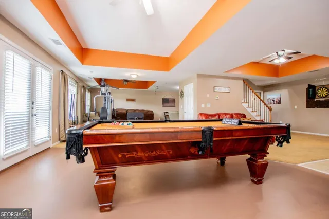 an aerial view of a house with a yard and lake view